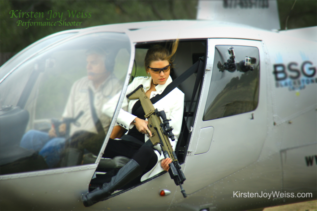 Shooting gun from Helicopter Kirsten Joy Weiss performance shooter