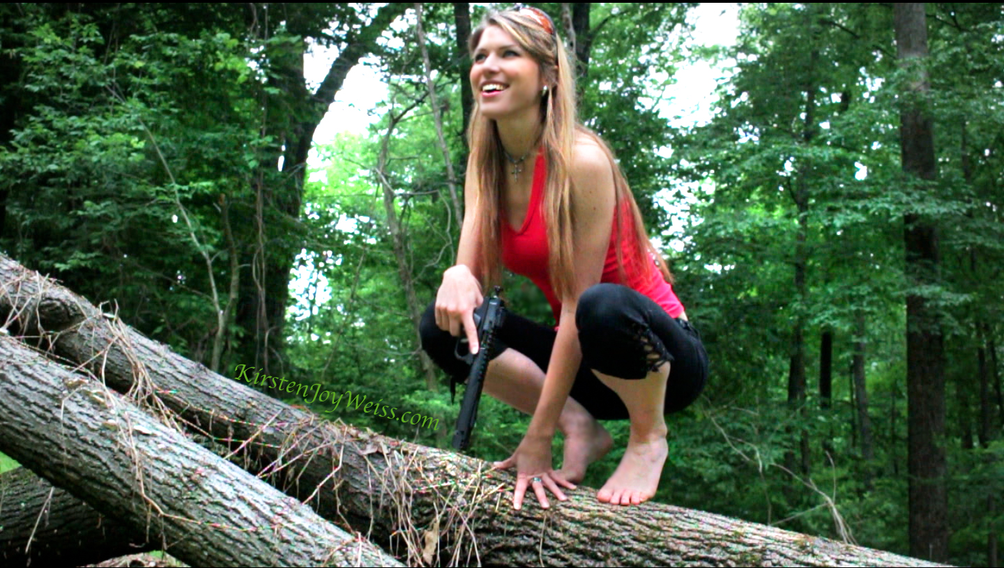 Kirsten Joy Weiss trick shot balancing on tree pistol words.